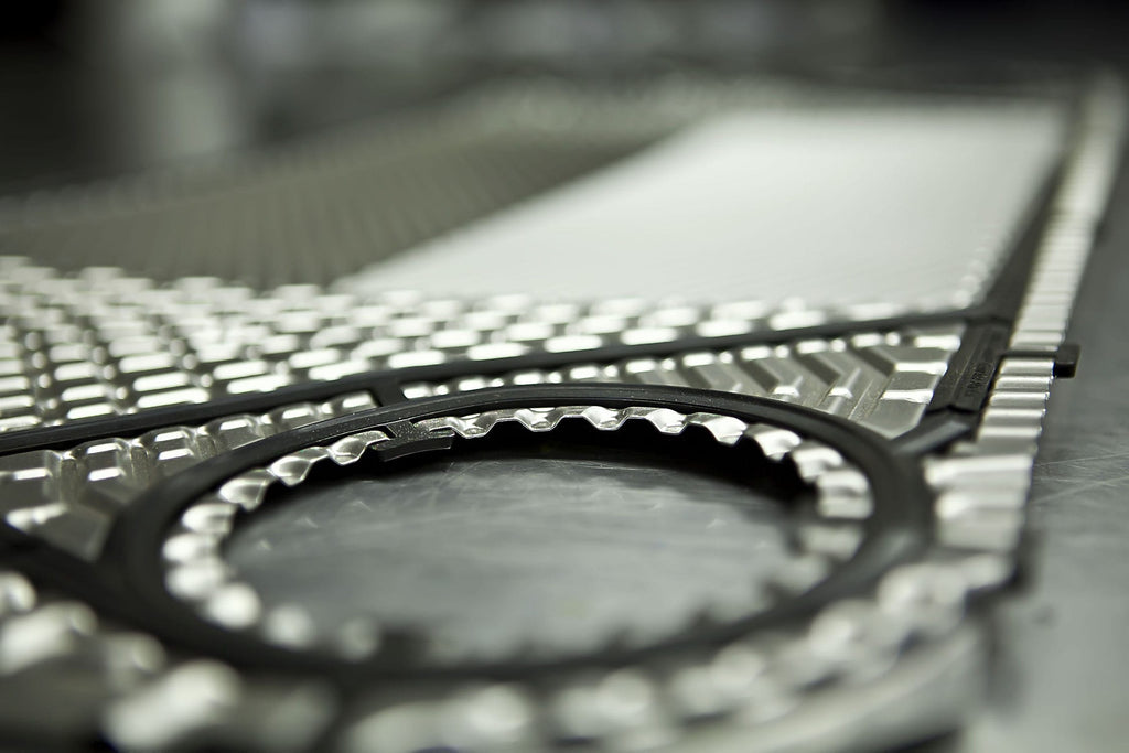 Alfa Laval-compatible clip-on gasket installed on plate heat exchanger – food-grade spare part for F&B processing